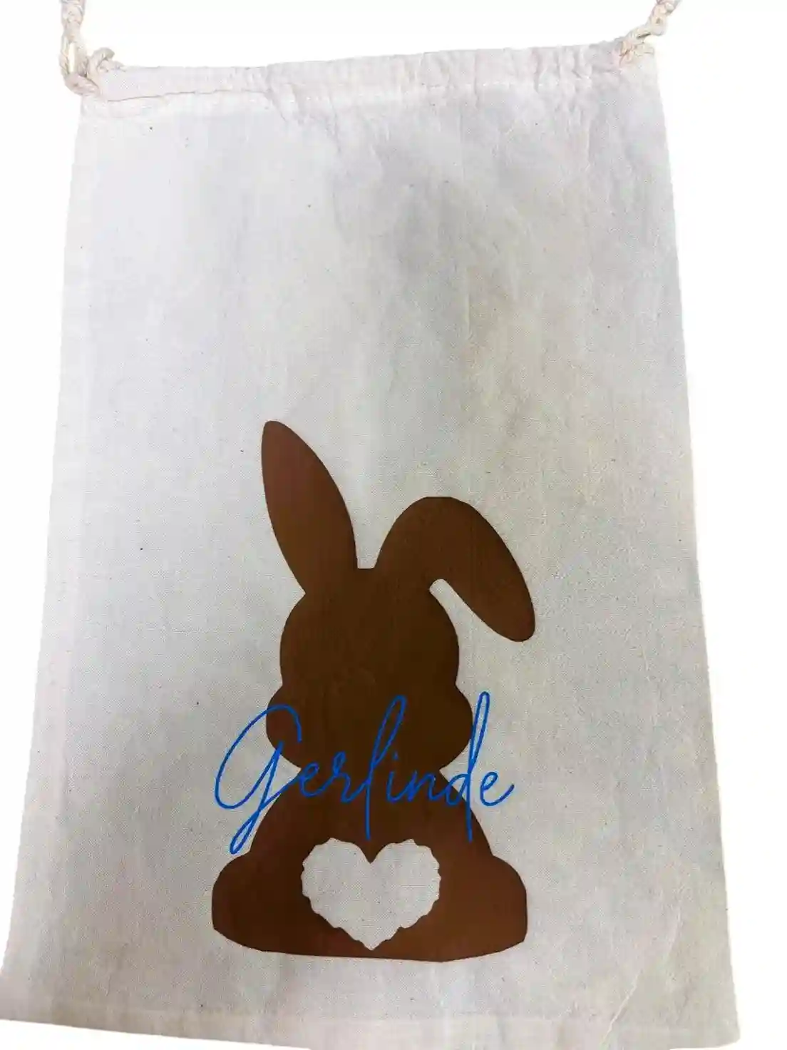 Oster-Baumwollsackerl mit dunkelbraunem Hasen und neonblauer Schrift